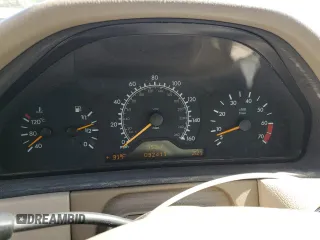 1999 Mercedes-Benz E-Class with VIN WDBJF65H5XA804902, listed as a Copart auction lot 73704634 with 92,411 mi miles and Salvage Title. Bid and sale history available at carsss.com. Image 9.