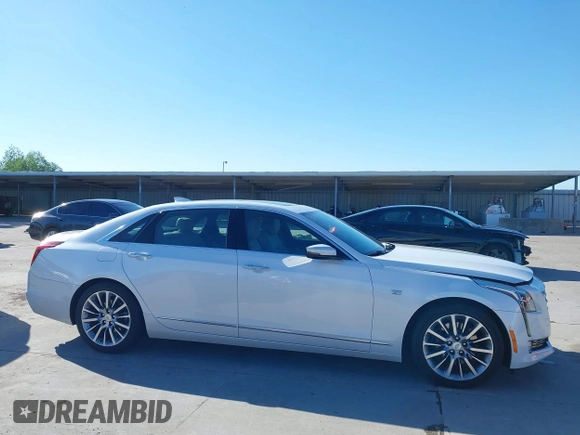 2018 Cadillac CT6 Luxury AWD z VIN 1G6KD5RS9JU151575, wystawiony jako IAAI lot #42078361 z przebiegiem 28 187 mil mil oraz . Historia ofert i sprzedaży dostępna na DreamBid. Obrazek 14.
