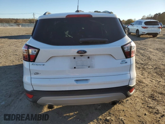2018 Ford Escape SE z VIN 1FMCU9GD3JUB16376, wystawiony jako Copart lot #83453484 z przebiegiem 163 251 mil mil oraz Szkody całkowita. Historia ofert i sprzedaży dostępna na DreamBid. Obrazek 6.