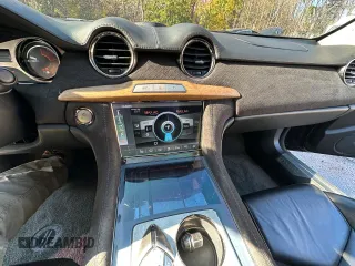 2012 Fisker Karma EcoSport z VIN YH4K14AA3CA001930, wystawiony jako Copart lot #79650354 z przebiegiem 47 417 mil mil oraz Tytuł czysty. Historia ofert i sprzedaży dostępna na DreamBid. Obrazek 9.