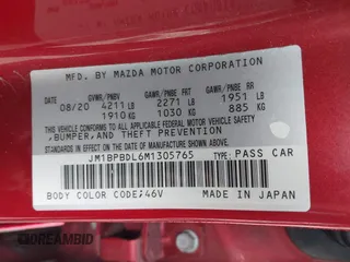 2021 Mazda 3 with VIN JM1BPBDL6M1305765, listed as a IAAI auction lot 42063684 with 61,011 mi miles and . Bid and sale history available at DreamBid. Image 9.