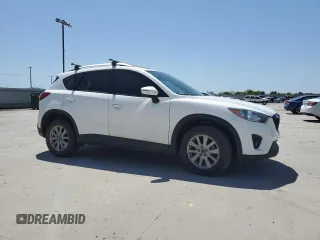 2015 Mazda CX-5 Touring with VIN JM3KE2CY5F0548826, listed as a Copart auction lot 52686565 with 139,602 mi miles and Salvage Title. Bid and sale history available at carsss.com. Image 4.