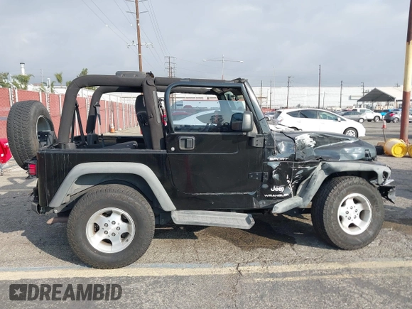 2003 Jeep Wrangler Sport with VIN 1J4FA49S23P328867, listed as a IAAI auction lot 41354414 with 96,703 mi miles. Bid and sale history available at carsss.com. Image 13.