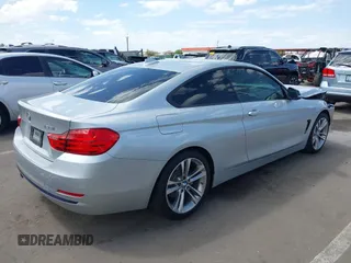 2015 BMW 4 Series 428i with VIN WBA3N7C54FK225045, listed as a IAAI auction lot 42042980 with 72,909 mi miles. Bid and sale history available at carsss.com. Image 4.