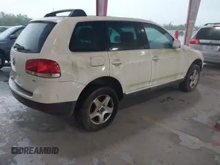 2004 Volkswagen Touareg with VIN WVGBC67L04D026451, listed as a IAAI auction lot 41859371 with 151,392 mi miles and . Bid and sale history available at DreamBid. Image 4.