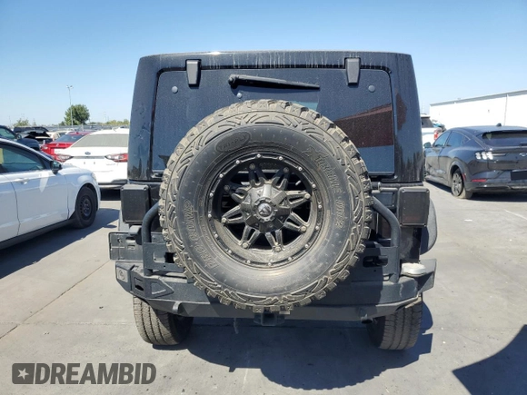2013 Jeep Wrangler Unlimited Rubicon 10th Anniversary with VIN 1C4HJWFG4DL550832, listed as a Copart auction lot 71633684 with 60,759 mi miles and Salvage title. Bid and sale history available at DreamBid. Image 6.