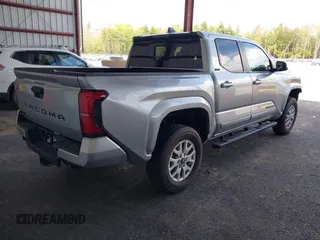 2025 Toyota Tacoma SR with VIN 3TMLB5JN7SM100983, listed as a IAAI auction lot 42220559 with 2,119 mi miles and . Bid and sale history available at DreamBid. Image 4.