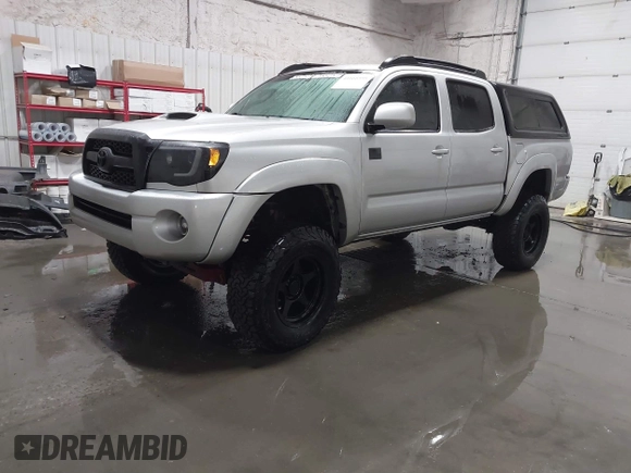 2011 Toyota Tacoma with VIN 3TMLU4EN9BM070836, listed as a IAAI auction lot 41668595 with 89,879 mi miles and . Bid and sale history available at DreamBid. Image 2.