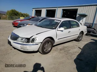 2002 Lincoln Continental with VIN 1LNHM97V62Y643532, listed as a Copart auction lot 76015984 with 154,374 mi miles and Salvage Title. Bid and sale history available at carsss.com. Image 1.