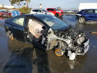 2022 Toyota Prius L Eco with VIN JTDKAMFU1N3179050, listed as a Copart auction lot 84764454 with 21,695 mi miles and Salvage Title. Bid and sale history available at DreamBid. Image 4.