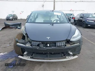 2018 Tesla Model 3 Long Range Battery with VIN 5YJ3E1EB9JF097118, listed as a IAAI auction lot 41619510 with 64,132 mi miles and . Bid and sale history available at DreamBid. Image 13.
