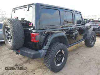 2020 Jeep Wrangler Unlimited Rubicon with VIN 1C4HJXFG1LW141335, listed as a IAAI auction lot 42724973 with 59,843 mi miles and . Bid and sale history available at DreamBid. Image 4.