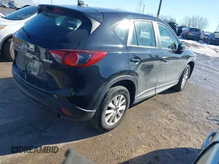 2014 Mazda CX-5 Sport with VIN JM3KE2BE7E0313978, listed as a IAAI auction lot 41437144 with 161,181 mi miles and . Bid and sale history available at carsss.com. Image 4.