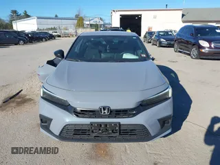 2022 Honda Civic Sport z VIN 2HGFE2F50NH601567, wystawiony jako IAAI lot #40880687 z przebiegiem 16 587 mil mil oraz . Historia ofert i sprzedaży dostępna na DreamBid. Obrazek 13.