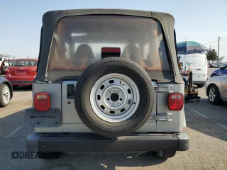 2000 Jeep Wrangler SE with VIN 1J4FA29P3YP770094, listed as a Copart auction lot 65419385 with 150,364 mi miles and Clean title. Bid and sale history available at DreamBid. Image 6.