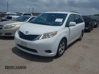 2014 Toyota Sienna LE AAS with VIN 5TDKK3DC0ES525654, listed as a IAAI auction lot 42153582 with 71,258 mi miles and . Bid and sale history available at carsss.com. Image 2.