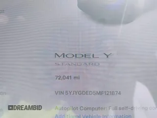 2021 Tesla Model Y Standard Range with VIN 5YJYGDED5MF121874, listed as a IAAI auction lot 41238170 with 72,041 mi miles and . Bid and sale history available at DreamBid. Image 7.