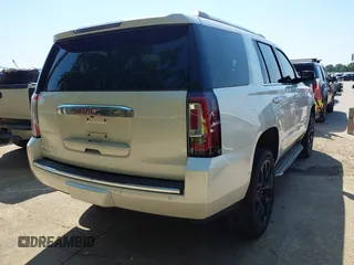 2015 GMC Yukon Denali with VIN 1GKS1CKJ8FR575730, listed as a IAAI auction lot 42048050 with 113,077 mi miles. Bid and sale history available at carsss.com. Image 4.