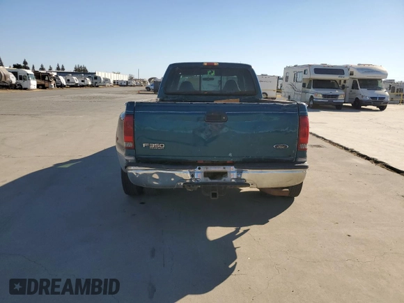 2000 Ford F-350 with VIN 1FTWW32S9YED99031, listed as a Copart auction lot 75952254 with 220,673 mi miles and Salvage title. Bid and sale history available at DreamBid. Image 6.