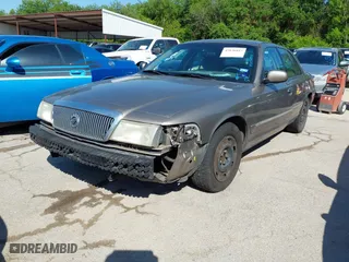 2003 Mercury Grand Marquis GS Convenience with VIN 2MEFM74W43X662724, listed as a IAAI auction lot 42036847 with 234,008 mi miles. Bid and sale history available at carsss.com. Image 2.