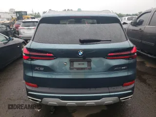 2024 BMW X5 xDrive40i with VIN 5UX23EU02R9T63818, listed as a Copart auction lot 60195525 with 26,773 mi miles and Salvage title. Bid and sale history available at DreamBid. Image 6.
