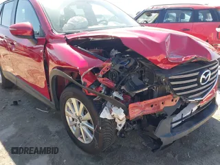 2016 Mazda CX-5 Touring with VIN JM3KE4CY0G0890309, listed as a IAAI auction lot 41890840 with 89,023 mi miles and . Bid and sale history available at carsss.com. Image 6.