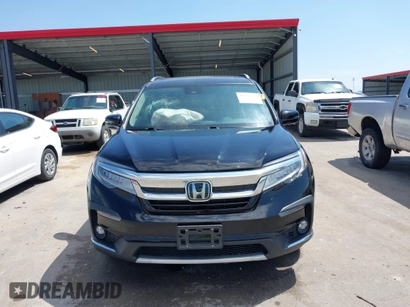 2019 Honda Pilot Touring 7-Passenger with VIN 5FNYF6H67KB031988, listed as a IAAI auction lot 42519588 with 41,368 mi miles and . Bid and sale history available at DreamBid. Image 12.