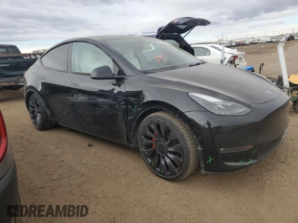 2022 Tesla Model Y Performance with VIN 7SAYGDEF3NF546385, listed as a Copart auction lot 83784984 with 30,769 mi miles and Salvage Title. Bid and sale history available at DreamBid. Image 4.