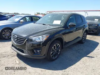2016 Mazda CX-5 Grand Touring with VIN JM3KE4DY9G0893174, listed as a IAAI auction lot 41887814 with 79,811 mi miles. Bid and sale history available at carsss.com. Image 2.