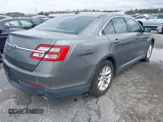 2014 Ford Taurus SE z VIN 1FAHP2D88EG143275, wystawiony jako IAAI lot #41801787 z przebiegiem 150 988 mil mil oraz . Historia ofert i sprzedaży dostępna na DreamBid. Obrazek 4.