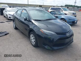 2019 Toyota Corolla L with VIN 5YFBURHE2KP875929, listed as a IAAI auction lot 42471393 with 102,297 mi miles and . Bid and sale history available at DreamBid. Image 1.