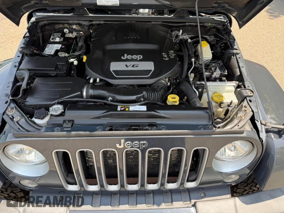 2016 Jeep Wrangler Unlimited Sahara with VIN 1C4BJWEG9GL169490, listed as a Copart auction lot 61507025 with 198,602 mi miles and Clean title. Bid and sale history available at DreamBid. Image 7.