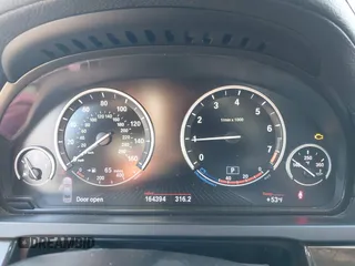 2013 BMW 7 Series 740i with VIN WBAYA6C55DC995094, listed as a IAAI auction lot 41246796 with 164,394 mi miles. Bid and sale history available at carsss.com. Image 7.