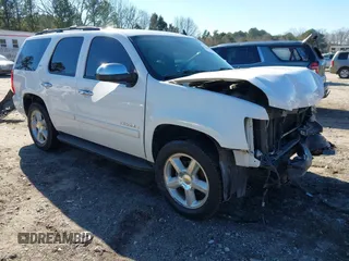 2008 Chevrolet Tahoe 3LT with VIN 1GNFC13028R119704, listed as a IAAI auction lot 41300204 with 202,777 mi miles and . Bid and sale history available at DreamBid. Image 1.