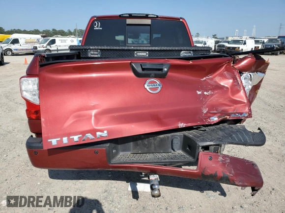2018 Nissan Titan SV z VIN 1N6AA1E58JN505703, wystawiony jako Copart lot #52498985 z przebiegiem 178 803 mil mil oraz Szkoda całkowita • Salvage title. Historia ofert i sprzedaży dostępna na DreamBid. Obrazek 6.