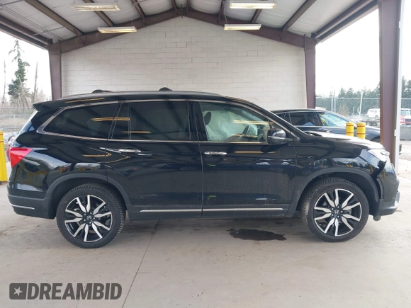 2021 Honda Pilot Elite with VIN 5FNYF6H04MB043014, listed as a IAAI auction lot 41826931 with 63,546 mi miles and . Bid and sale history available at DreamBid. Image 13.