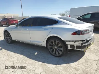 2013 Tesla Model S с VIN 5YJSA1CN5DFP05936, выставлен на аукционе Copart как лот 51831795 с пробегом Не указан миль и Списание • Salvage title. История ставок и продаж доступна на DreamBid. Изображение 2.