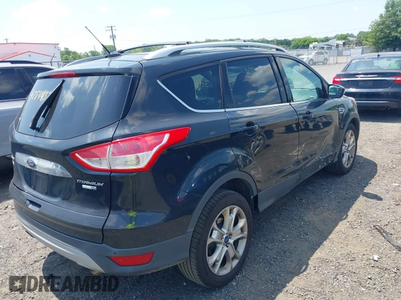 2015 Ford Escape Titanium with VIN 1FMCU9J96FUC01790, listed as a IAAI auction lot 42844336 with 133,005 mi miles and . Bid and sale history available at DreamBid. Image 4.