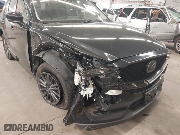 2020 Mazda CX-5 Touring with VIN JM3KFBCM9L1785125, listed as a IAAI auction lot 41983561 with 101,062 mi miles and . Bid and sale history available at carsss.com. Image 6.