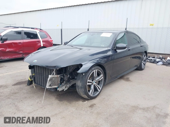 2019 BMW 7 Series 750i with VIN WBA7F0C50KGM26010, listed as a IAAI auction lot 42188421 with 71,576 mi miles and . Bid and sale history available at DreamBid. Image 2.