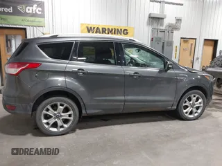 2016 Ford Escape Titanium with VIN 1FMCU9J93GUC39933, listed as a IAAI auction lot 42616323 with 116,482 mi miles and . Bid and sale history available at DreamBid. Image 13.