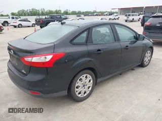 2012 Ford Focus SE with VIN 1FAHP3F21CL372769, listed as a IAAI auction lot 42107424 with 202,142 mi miles. Bid and sale history available at carsss.com. Image 4.