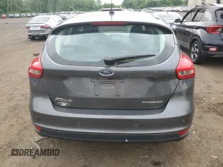 2017 Ford Focus Titanium z VIN 1FADP3N29HL240527, wystawiony jako Copart lot #62891695 z przebiegiem 126 926 mil mil oraz Szkoda całkowita • Salvage title. Historia ofert i sprzedaży dostępna na DreamBid. Obrazek 6.