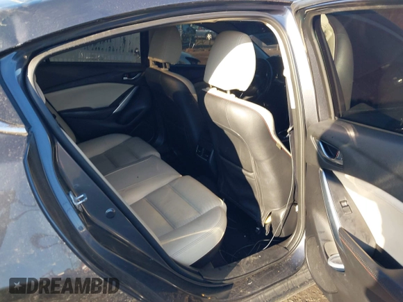 2014 Mazda 6 i Grand Touring with VIN JM1GJ1W50E1107877, listed as a IAAI auction lot 41857596 with 166,188 mi miles and . Bid and sale history available at DreamBid. Image 8.