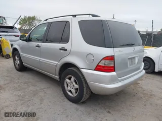 2001 Mercedes-Benz M-Class with VIN 4JGAB54E71A231597, listed as a IAAI auction lot 42058829 with 233,005 mi miles. Bid and sale history available at carsss.com. Image 3.