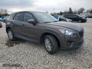 2016 Mazda CX-5 Touring with VIN JM3KE2CY8G0902131, listed as a Copart auction lot 53354745 with 123,474 mi miles and Salvage Title. Bid and sale history available at carsss.com. Image 4.