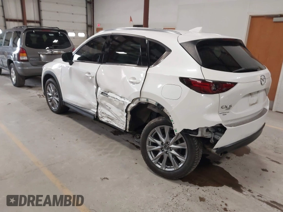 2020 Mazda CX-5 Grand Touring with VIN JM3KFBDM6L1828611, listed as a IAAI auction lot 42006976 with 59,939 mi miles and . Bid and sale history available at DreamBid. Image 3.