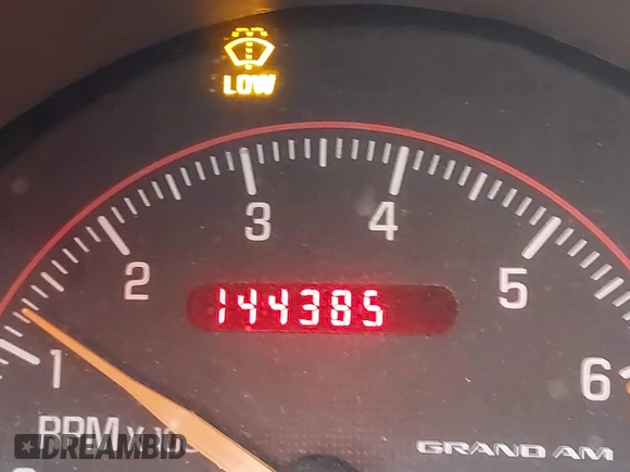 2004 Pontiac Grand Am z VIN 1G2NV12EX4M641018, wystawiony jako IAAI lot #41255352 z przebiegiem 144 385 mil mil oraz . Historia ofert i sprzedaży dostępna na DreamBid. Obrazek 16.