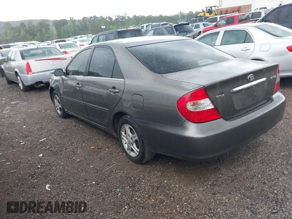 2004 Toyota Camry LE with VIN 4T1BE30K24U921028, listed as a IAAI auction lot 42187174 with 295,174 mi miles and . Bid and sale history available at DreamBid. Image 3.