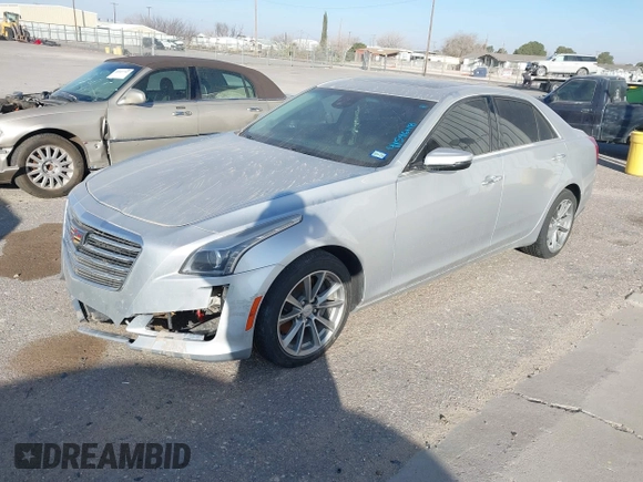2019 Cadillac CTS Luxury RWD with VIN 1G6AR5SX7K0110826, listed as a IAAI auction lot 41596118 with 58,387 mi miles and . Bid and sale history available at DreamBid. Image 2.